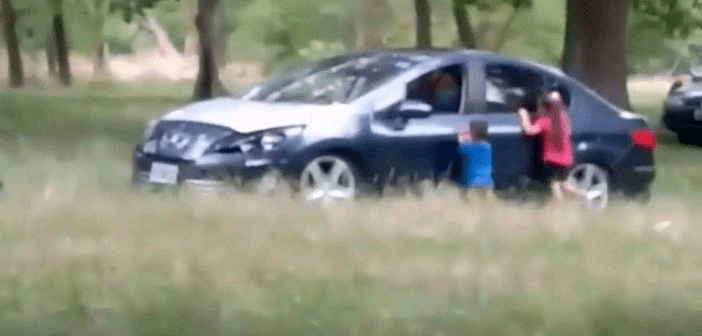 Two young children are made to wait beside their mother’s car while she ‘jogs with new lover on rear seat’